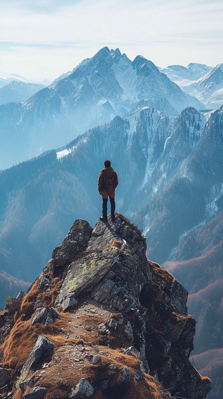 Traveller looking out over a mountain range
